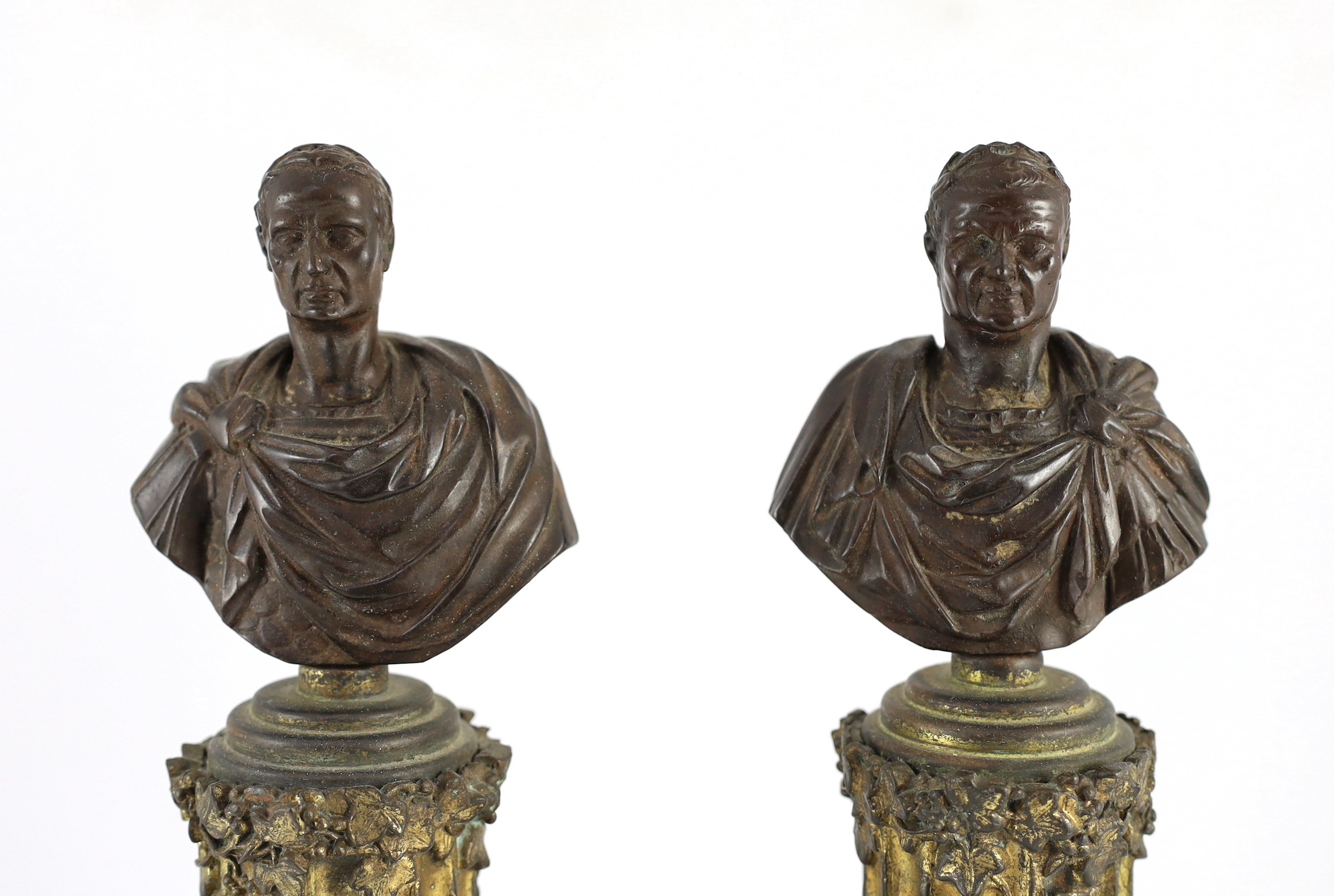 After the Antique. A pair of bronze busts of Roman Emperors, width of bases 12cm height 45cm